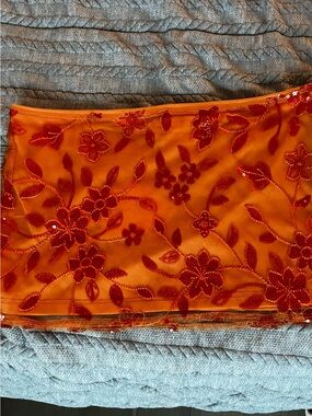 Peppermayo Orange Mesh skirt  with Red Sequin Floral Motif XL size